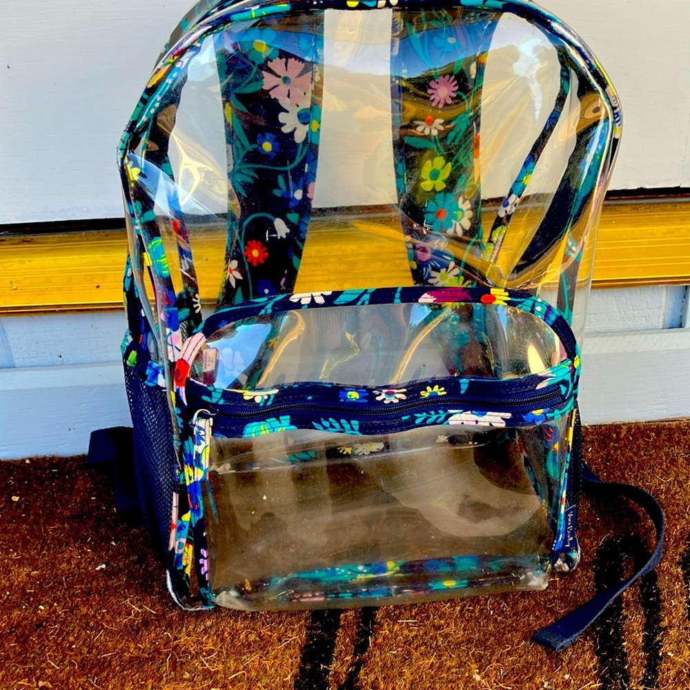 A vera Bradley backpack has three tiny tears on the cupholder.